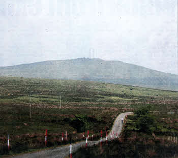 The serenity of Divis mountain is deceptive. Harsh weather condltions in May could cause headaches for the farmer who had just put his cattle out to graze.