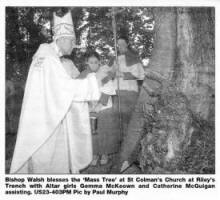 Bishop Walsh blesses the 'Mass Tree' at St Colman's Church at Riley's Trench with Altar girls Gemma McKeown and Catherine McGuigan assisting. US23-403PM Pic by Paul Murphy