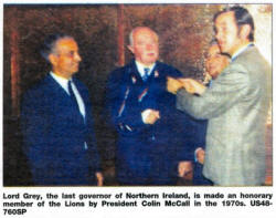 Lord Grey, the last governor of Northern Ireland, is made an honorary member of the Lions by President Colin McCall in the 1970s. US48-760SP