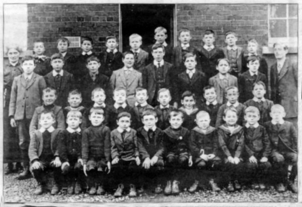 The teachers at Ballycarrickmaddy School in 1916 Mr. Lamont and Miss Begley with some of the pupils they taught - 
			