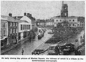 An early closing day picture of Market Square, the tidyness of which is a tribute to the bomb-harassed townspeople.