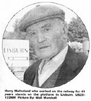 Harry Mulholand who worked on the railway for 41 years stands on the platform in Lisburn. US25-122NM Picture By: Niall Marshall