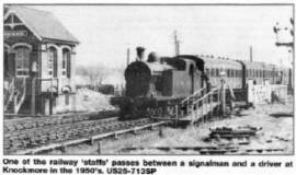 One of the railway 'staffs' passes between a signajman and a driver at Knockmore in the 1950's. US25-713SP