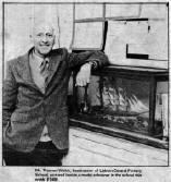 Mr. Thomas Welch, headmaster of Lisburn Central Primary School, pictured beside a model schooner in the school this week. E1406.