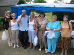 Crooner Brian Thompson entertains some ladies at the cake stall during the Garden Party at Kilwarlin Moravian Church on Saturday 10th June. L to R: Margaret Gibson, Alice Heatley, Brian Thompson, Hazel Scott, Valerie Walker, Hazel Law (Church Treasurer) and Violet Best.