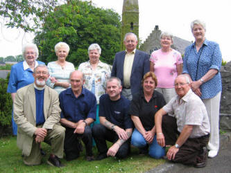 Derriaghy Parish Fete fundraising and organising committee pictured at Christ Church, Derriaghy last Saturday afternoon.  L to R: (front row) Rev John Budd - Rector, Bruce Hilland, Colin Ross, Carol Ross and Jim Braden.  (back row) Miss Vance Addis, Ada Kirkwood, Anna Duncan, Desmond Jardin, Trudy Hall and Pat Allen - Fundraising Chairperson.