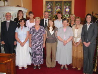 The Challenge Ethiopia Team 2006 pictured at a Commissioning Service in Ballinderry Parish Church last Sunday (25th June). L to R: (front row) Rev Canon Ernest Harris, Melinda Steele, Sandra Livingstone, Susanna Tuft, Heather Tuft, Ray Harris and Valerie Ellis � Team Leader (Crosslinks). (back row) Jenna Boyd, Mona Thomas, Paul Hendron, Michael Hendron and Jill Hendron. Missing from the photo: Rae Gamble and Kenny Clements
