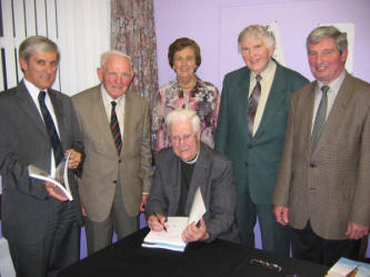 Dean Norman Barr pictured signing copies of his new book last Thursday evening (29th June) at Christ Church, Derriaghy.  Included in the photo is L to R: John Williams, Canon James Musgrave, Winifred Bell, Stanley Bell and Leonard Jarvis.