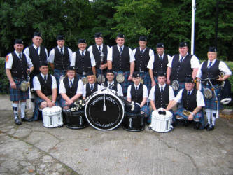 Pipe Major William Jackson (left) and Magheragall Pipe Band pictured at Lowquarter Orange Hall prior to the short walk to the District Service at Magheragall Parish Church last Sunday morning. The immaculately turned out band won Best Overall Band at a Mini Twelfth Parade in Lurgan last Friday night.
