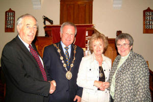 The Right Worshipful the Mayor - Councillor Trevor Lunn and the Mayoress - Mrs Laureen Lunn are welcomed to Ballinderry Moravian Church by Br Henry Wilson (left) and the Rev Jan Mullan (right).