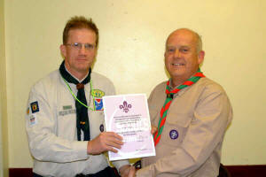 Noel Irwin - District Commissioner pictured presenting a certificate to Alan Toole for Outstanding service to scouting at 1st Hillhall Scout Group