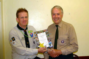 Noel Irwin - District Commissioner pictured presenting a Volunteering Achievement certificate to Lawrence Hook  - 1st Anahilt Scout Group.
