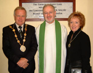 The Very Rev. John Murray, P.P. is pictured welcoming the Mayor - Councillor Trevor Lunn and the Mayoress - Mrs Laureen Lunn to St. Luke�s Church, Twinbrook, last Saturday evening.