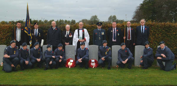 Pictured at the twenty-one Commonwealth War Graves at Eglantine Parish Church are L to R: (back row) Maurice Hanna (People�s Warden), Brian Fitzsimons (Standard Bearer - 31 Group, Royal Observer Corps Association), Paddy Malone, Wing Commander Harry Allen, the Rector - Rev Canon William Bell, Flt Lt Roy Kerr (OC 817 Lisburn ATC), David Orr and Geoffrey Simpson (Rector�s Warden). Included in the front row are Cadets from 2004 Ballynahinch Squadron.