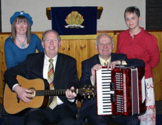 Taking part in an 'Old Fashioned Gospel Praise Service' in Dunmurry Free Presbyterian Church on Monday 2nd April were L to R: (seated) Rev Dr Fred Greenfield and the Rev Dr William McCrea. (standing) Mrs Jacqueline Moore (organist) and Mrs Kathryn Mitchell. The evening of gospel was one of three special services held last weekend to mark the 50th anniversary of Free Presbyterian witness in Dunmurry.