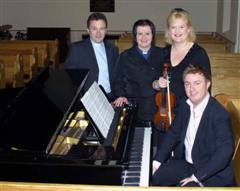 L to R: The Rev Paul Dundas - Rector, the Rev Diane Matchett - Curate, Hayley Howe - Violinist and Richard Yarr - Organist (seated at piano) pictured at the first of three lunchtime concerts entitled 'Music in May' in Christ Church Parish on Tuesday 15th May.