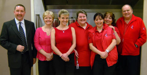 The catering team from Atlas (Adult Training Learning and Support - Sloan Street, Lisburn) who provided a delightful four-course dinner to celebrate the 20th anniversary of Magheragall Parish Senior Citizens' Club last Wednesday afternoon (31st January).  L to R:  Bobby Cunningham, Sharon Cunningham, Alison Walker, Helen Watson, Gay Sherry, Dorothy Sherry and Stephen Reid.  