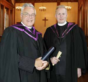 The Rev Dr Jack Richardson pictured being presented with his degree citation by the Rev Professor Patton Taylor, Principal of the Union Theological College, Belfast.