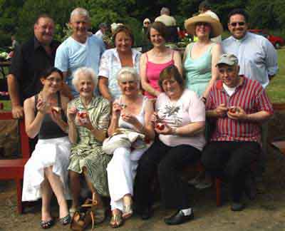 Enjoying strawberries and cream at the Garden Party at Kilwarlin Moravian Church last Saturday afternoon (9th June). (front row) Jennifer Johnston, Masie McMinn, Norma Miller and Elizabeth Dunn (former Ballinderry woman now living in Dublin) and her brother James Johnston, a member of Ballinderry Moravian. (back row) Billy Gibson and Brian Thompson (Band - 2 of Us), Doreen Smyth, Liz Ward, Sr Patsy Holdsworth and Rev Paul Holdsworth.