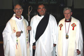 Rev Jim Martin (retired Rector of Mallusk) congratulates John McClure (right) who was Ordained in the Auxiliary Ministry for the Curacy of Skerry, Rathcavan and Newtownards at a service of Ordination. Looking on is the The Most Reverend Alan Harper - Archdeacon of Armagh.