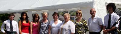 Pipers Peter Gray (left) and Michael Woods (right) pictured with some of the stall attendants at the new marquee at the Garden Party at Kilwarlin Moravian Church last Saturday afternoon 9th June.