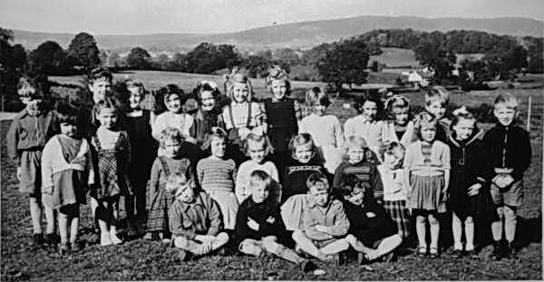 Year 1960 approx: L to R: (back row) 1. ? 2. ? 3. ? 4. ? Millar/Coates. 5. ? 6. ? 7. Rosemary Allen/Spindlow. 8. ? 9. ? l0. Elizabeth Drennan. Middle Row: 1. ? 2. Elma Adams. 3. Eleanor Abbott. 4. Barbara Coleman, 5. ?Henderson 6 Dorothy Alexander, 7 Roberta Gill. 8. ? 9. Margaret Drennan (Crowe) 10. ? 11. ? (Front Row): 1 Bertie Coleman. 2 Tommie Combs 3. Robert Hall. 4. Eric Millar