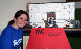 Lisa McClelland (Team Leader) shows a model of an African house with computer label bricks bought and signed by members of the congregation in order to raise funds for the Young Adults Group?s trip to Malawi on Friday 13th July.