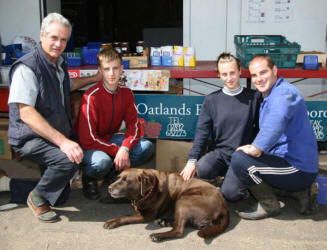 At the shop in the yard of Oatlands Fruit Farm last Saturday morning are Jim Law (owner) and fruit pickers (foreign students) - Paulius Pocius (Lithuania) and Lydia Ilieva and Hristomir Grigorov from Bulgaria.