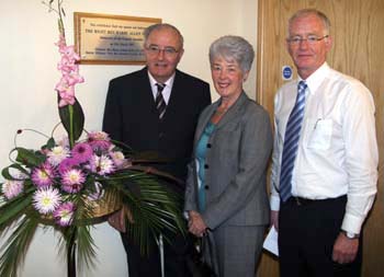 John Robinson pictured with some of his award-winning dahlias that were used in many of the floral decorations at Railway Street Harvest Thanksgiving Services last Sunday (14th October). Looking on are Elma Lindsay who co-ordinated the displays and the minister, the Rev Brian Gibson.