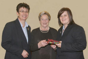 First Lisburn PWA President Eleanor McFadzean presents a gift to Strand Presbyterian Church Deaconess Sharon Heron (right) at the PWA service in First Lisburn Presbyterian Church last Sunday morning. Looking on is First Lisburn Deaconess Evelyn Whyte (left). 