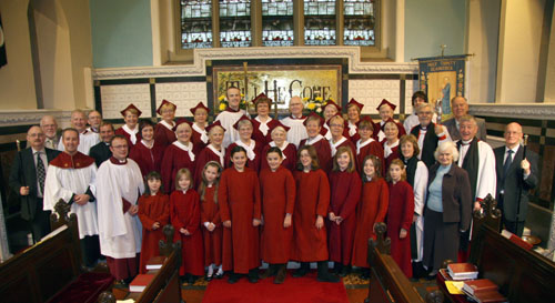 Organist Stephen Timpany (third from left at front) pictured with the Junior Girls? Choir, Senior Church Choir, church staff, sexton, churchwardens and special guests at the Service of Dedication in Holy Trinity, Banbridge last Sunday morning (25th November).