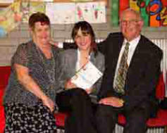 Laura Moore pictured with her godparents/grandparents - Ella Castles and John Moore at a confirmation service in St Paul's Parish on Sunday 4th March.