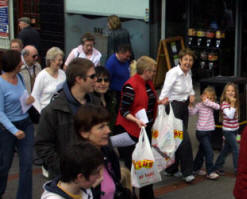 Little Cara and Katie Watson (from Dubai) join in the annual Good Friday 'Carrying of the Cross' march of witness. 