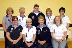 L to R: (seated) Lorraine Hamill (County Commissioner South Antrim), retiring Brownie leaders Margaret Benson and Irene Bethel and Julie Rankin (District Commissioner). (back row) 1st Derriaghy Guide, Brownie and Rainbow leaders Alexis Burrows, Rosemary Fell, Barbara Morrison, Carla Budd and Julie Aitken.