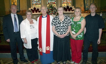 Canon Cochrane and his family. L to R: Michael, Eleanor, Canon Cochrane, Mrs Mildred Cochrane, Emma and Simon.