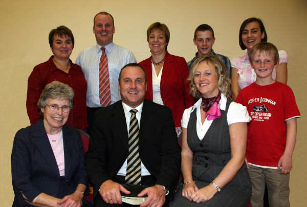 Pastor Richard Garnham pictured with his mother Sylvia, wife Elaine and son Ryan (right) and L to R: (back row) Brother Rodney and sister-in-law Jacqueline Garnham; sister Karen McComb; and nephew Joshua and niece Leah.