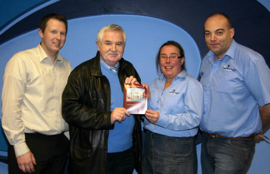 At the handover of the final copy of the book are L to R: Andrew Smyth - Studio Manager,  John Kelly, Yvonne Campbell - Designer and Adrian Glenn - Managing Director of Impression Print and Design.