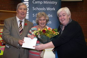 Dorothy Armstrong present gifts to Tom and Joan McKinstry in recognition of their exemplary service to BCM.