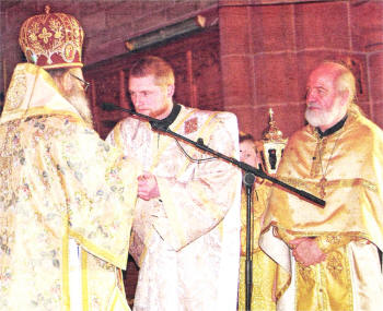 Deacon Paul Totten during the service with His Emminence Metropolitan John and Father Irenaus