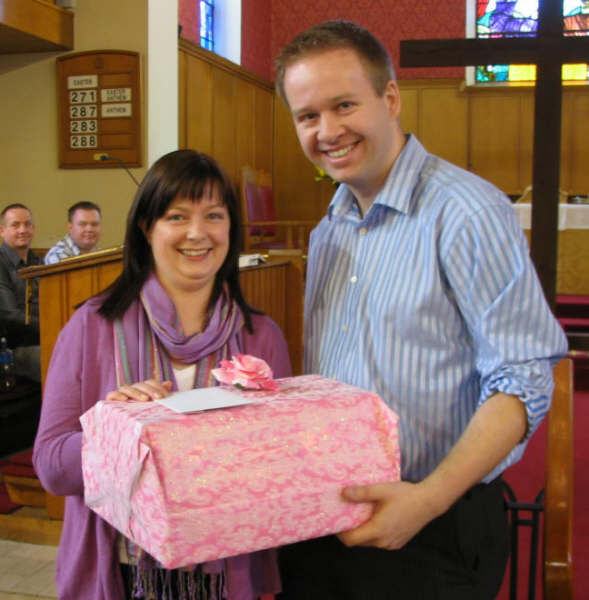 Richard McCrossan presents a gift on behalf of the Praise Band to Elaine Coey on Easter Sunday, her last service as Director of Music of St Paul’s Parish before moving to St John’s, Killyreagh.