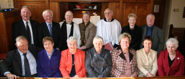 The rector, the Rev Canon Robert Neill, the Organist, Mrs Sheila Press and Parish Reader, Mr John Denton pictured with members of the church choir at morning worship in Holy Trinity Parish Church, Drumbo on Easter Sunday.