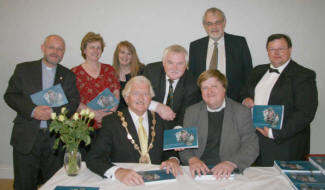 John shows a copy of the book to Councillor Ronnie Crawford (Lisburn Mayor) and the Rev Dr David Steers (Minister of Downpatrick, Balee and Clough Non-Subscribing Presbyterian Churches). 