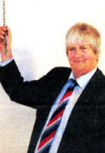 Brian Law ringing the church bell to welcome the congregation to the special service.