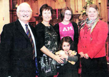 Former Lisburn Mayor Councillor Ronnie Crawford and his wife lean with Karen Blythe and her daughters Sophie and Kate-Lynn at morning worship in Railway Street Presbyterian Church last Sunday [February 14).
