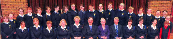 L to R: (front at centre) Mrs Karen Carson (GB Captain), Rev David Porter (Chairman), Mrs Norma Porter and Mr Herbie Chambers (Clerk of Session) pictured with officers and girls of Second Dromara Girls' Brigade at their 40th anniversary service.