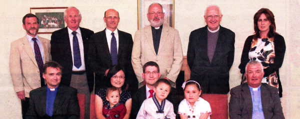 Volker and JinHyeog Glissmann and their young family with friends of Harmony Hill Presbyterian Church.
	