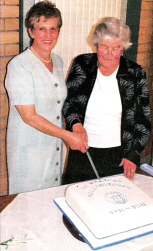 Mrs. Jeanette Shannon and Mrs. Bunty Hawkins cut the cake commemorating 100 years of the Mothers Union in Hillsborough.