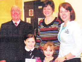 Pupils receive their Bible's from Pastor Clifford Morrison, Carr Baptist Church, Mrs. Greer, Principal of Carr Primary School and Rachel Brown, The Amazing Journey Co-ordinator.