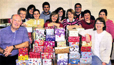 Helpers at Elmwood Presbyterian Church prepare their shoebox presents for Potter House at Timisoara in Romania. US4511-413PM Pic by Paul Murphy 