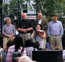 Pauline Connell pictured singing 'Amazing Grace' at a short act of worship in Market Square, Lisburn following the annual Good Friday 'Carrying of the Cross March of Witness'.